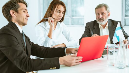 The business people working together at table. The meeting or summit concept